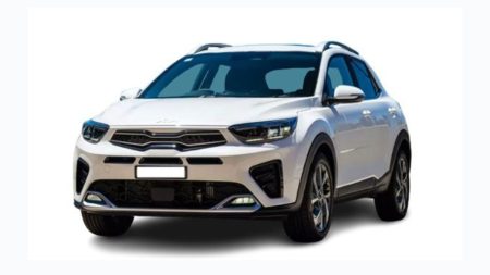 Red 2025 Kia Stonic parked on road in Pakistan