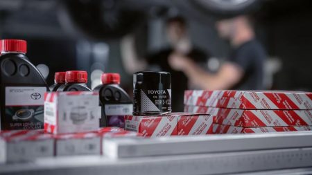 A display of genuine Toyota car parts available in Pakistan including brake pads, filters, and headlights in 2025