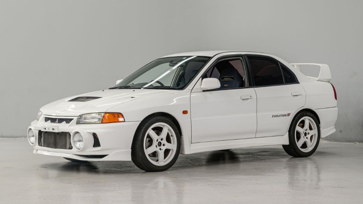 Mitsubishi Lancer 1997 vintage car parked on city street in Pakistan