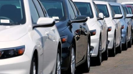 Used cars displayed at a dealership in Pakistan after ban lifted on imports under IMF deal