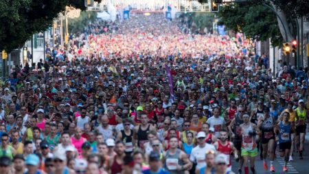 Runners participating in a marathon race in Pakistan 2025 with scenic route and enthusiastic crowd