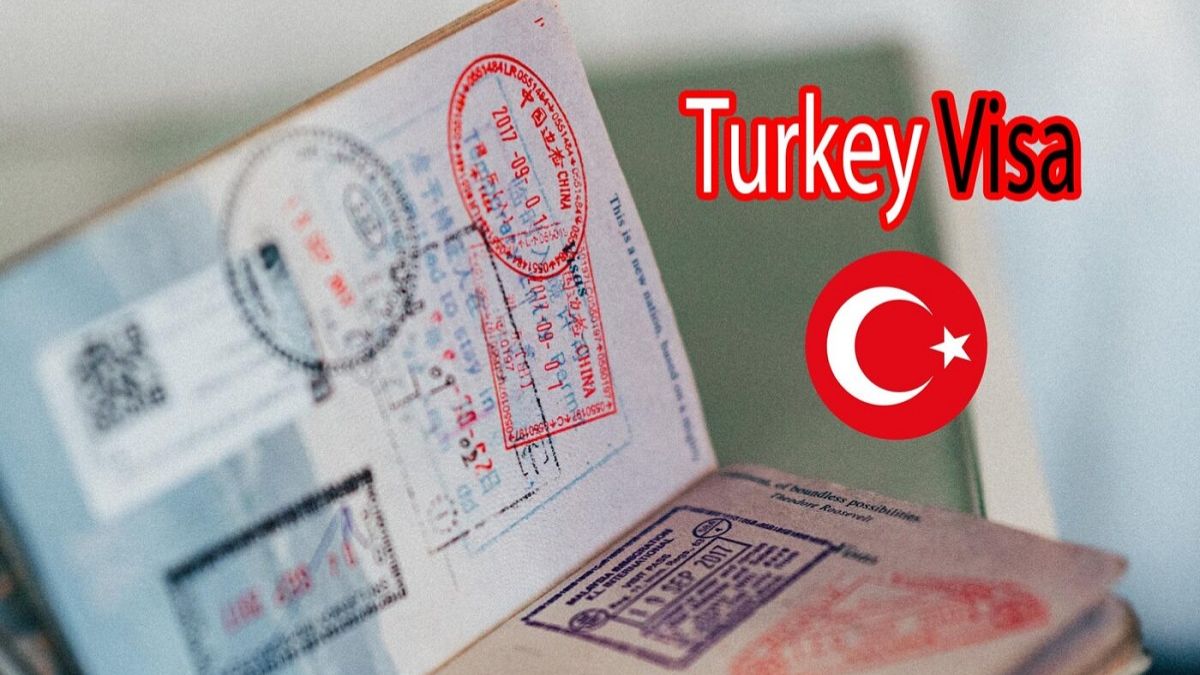 Turkish visa stamp on a Pakistani passport with travel documents