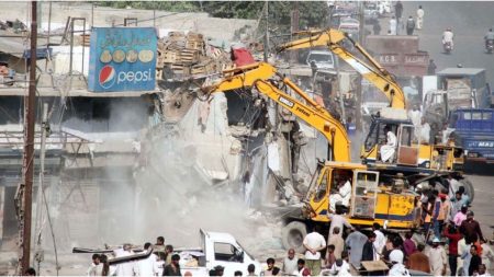 CDA vehicles removing illegal structures in Islamabad Diplomatic Enclave