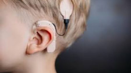 Child receiving cochlear implant surgery in Pakistan hospital