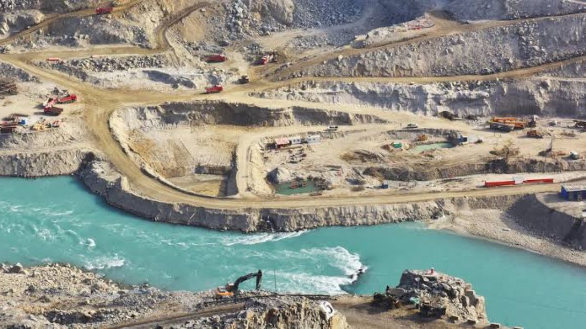 Aerial view of Diamer Bhasha Dam construction on the Indus River in Pakistan, showing cranes and concrete structure development in 2025