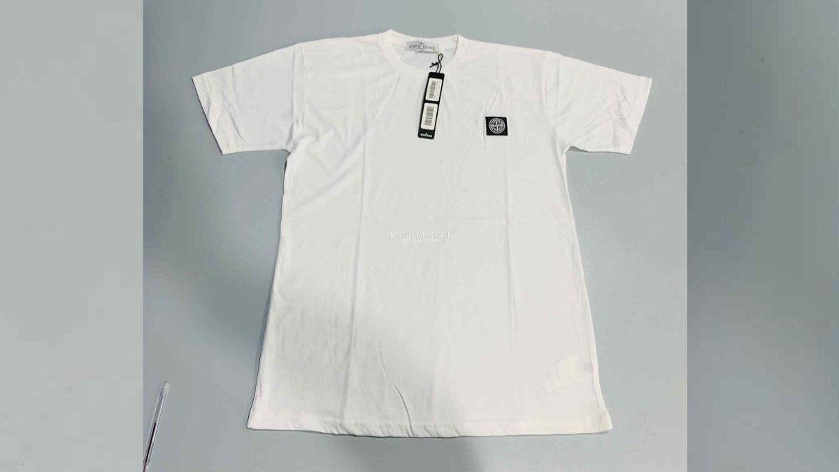 Stacks of leftover T-shirts in a Pakistani garment factory prepared for international export