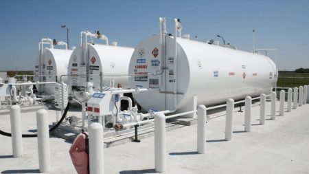 Aerial view of a modern aviation fuel farm with storage tanks and safety systems