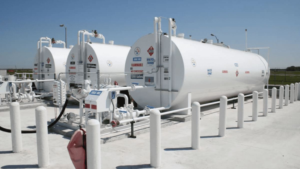 Aerial view of a modern aviation fuel farm with storage tanks and safety systems