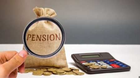 A somber-looking woman receiving official documents, representing the new policy on limited pension duration for spouses of deceased government employees.