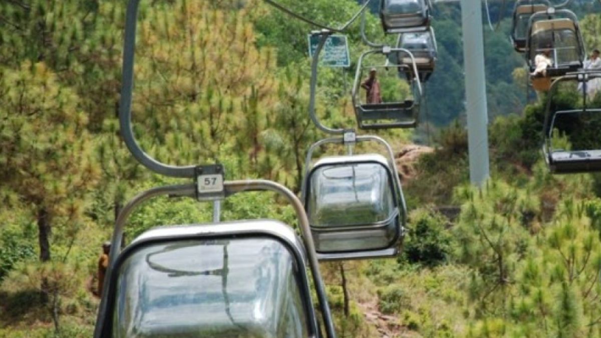 Chair lift view in Pakistan with scenic mountains and pine forests 2025