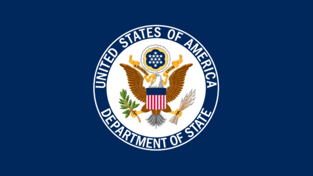U.S. State Department seal with American flag and breaking news headline