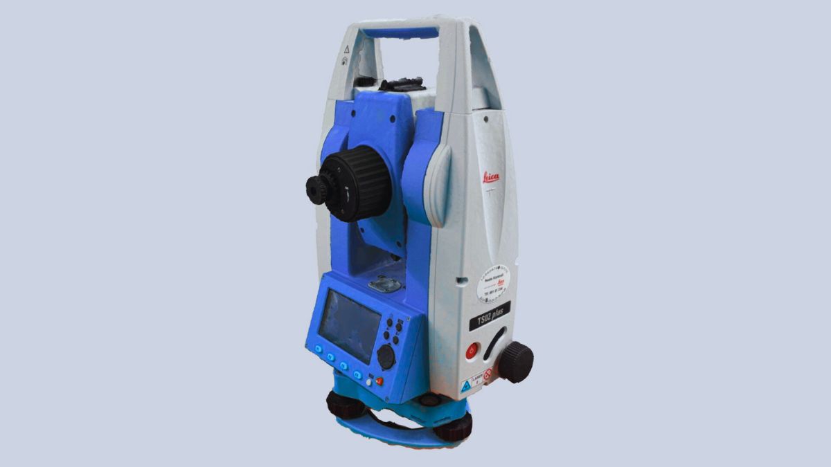 Modern total station mounted on a tripod being used for land surveying in Pakistan, 2025