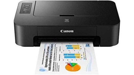 A high-quality Epson and Canon photo printer available in Pakistan in 2025 with ink bottles and photo paper