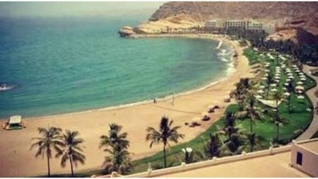 Vibrant wooden French beach huts lined up along the Normandy coastline