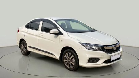 Side view of Honda City 1.2 2025 parked on road