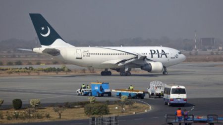 PIA airplane on runway for Karachi to Lahore domestic flight in 2025