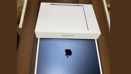 Apple MacBook M2 in Midnight color displayed on desk with open screen