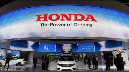 Exterior of authorized Honda service centre in Lahore with service bays and signage