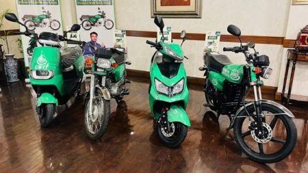 Female teachers in Sialkot being handed free electric bikes