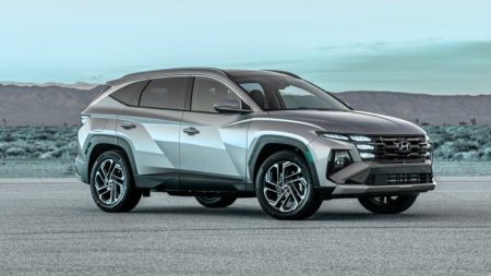 Hybrid Car Technology in Pakistan: Benefits, Models & Future Trends 2025 Hybrid car driving on city road in Pakistan with eco-friendly technology