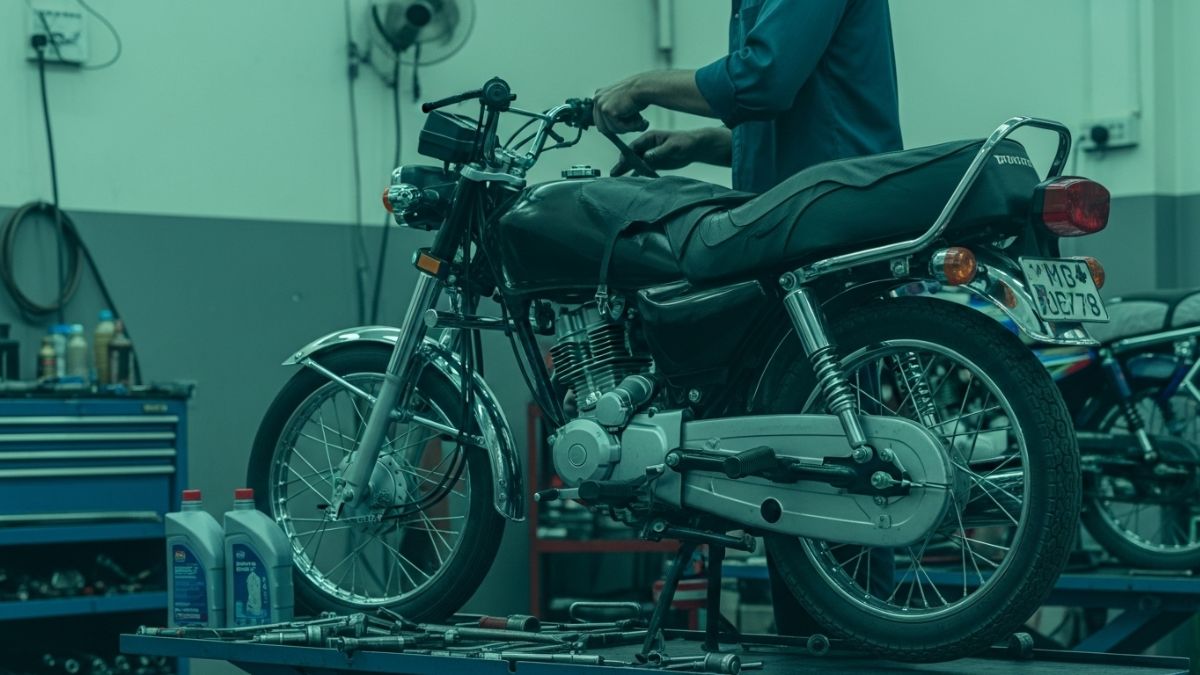 Motorcycle servicing in Karachi with mechanic tuning bike in workshop
