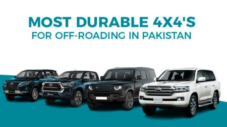 Various offroad vehicles parked in rugged terrain in Pakistan