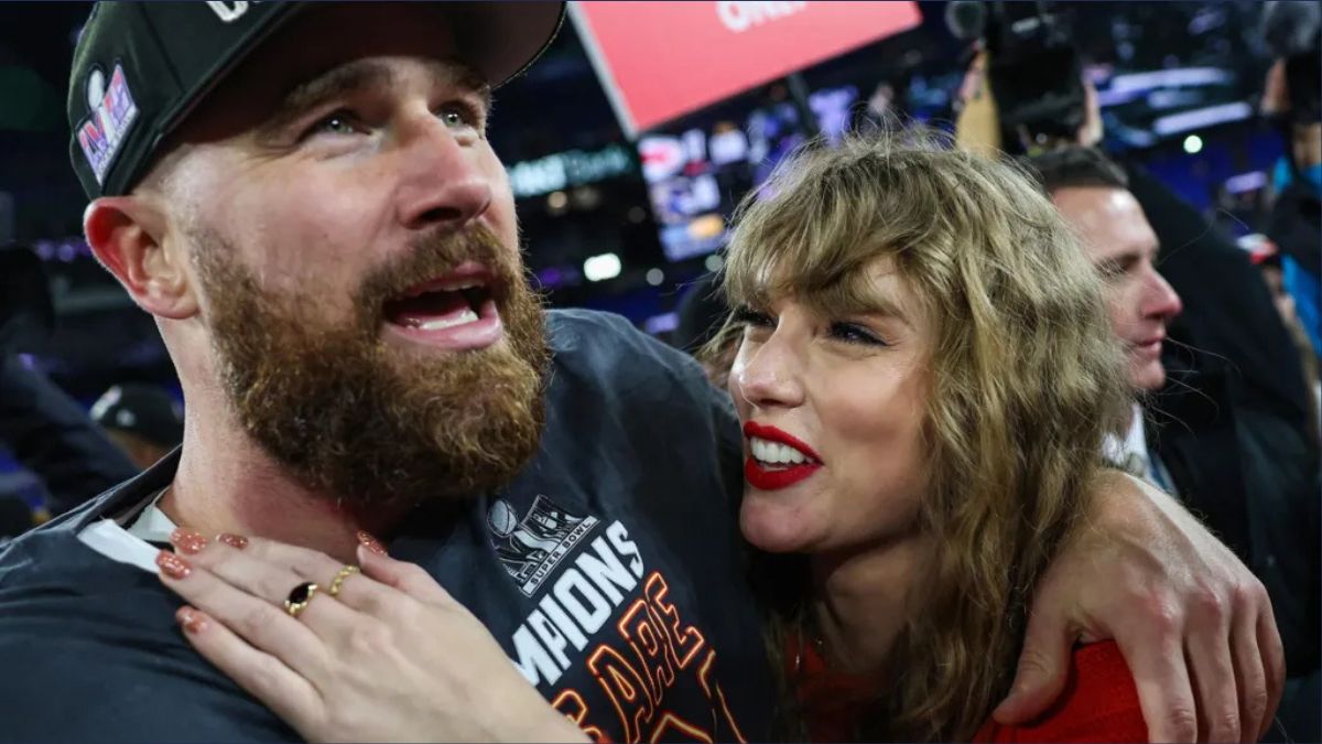Taylor Swift smiling with Travis Kelce in a romantic moment