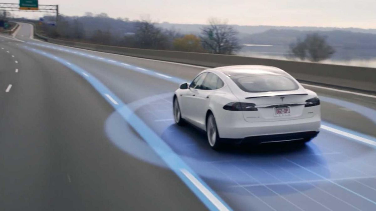 Waymo autonomous self-driving taxi providing ride-hailing service in a busy urban environment in 2025.